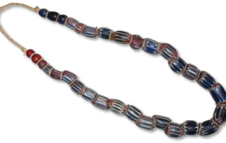 Old Venetian chevron beads made of glass used as trade beads during the slave trade in West Africa. Picture is taken at Suntrade Ltd., Accra, Ghana - Trade Bead Migration into North America - Crazy Crow Trading Post